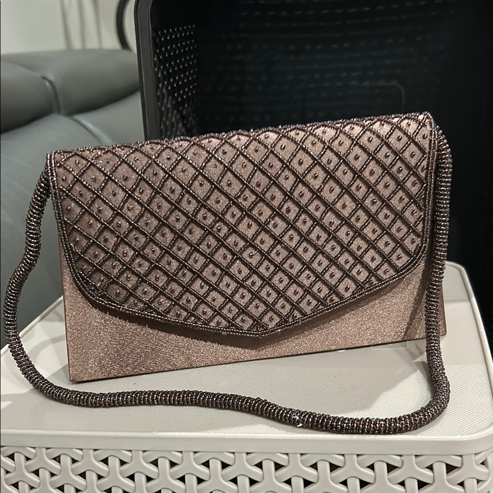 Brown Textured Clutch with Geometric Pattern